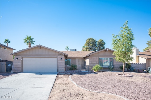 single story home featuring a garage