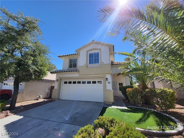 mediterranean / spanish-style home featuring a garage