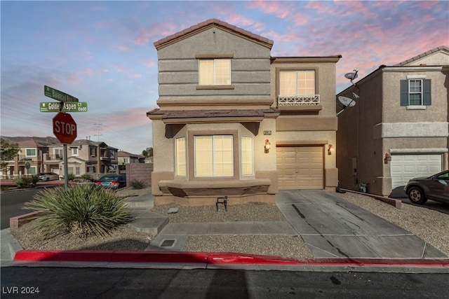 front facade with a garage