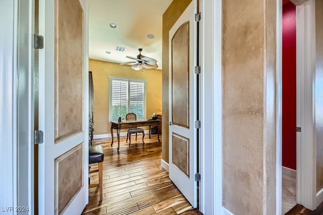 hall with light hardwood / wood-style floors