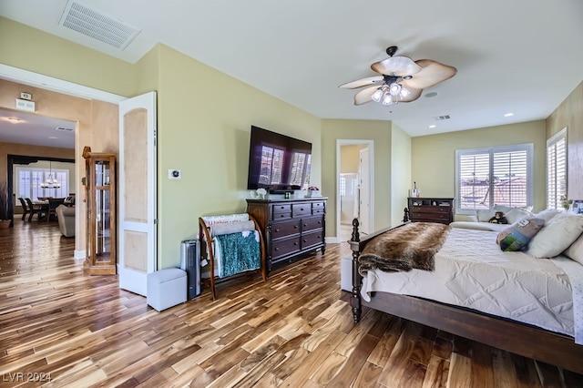 bedroom with ceiling fan and hardwood / wood-style floors