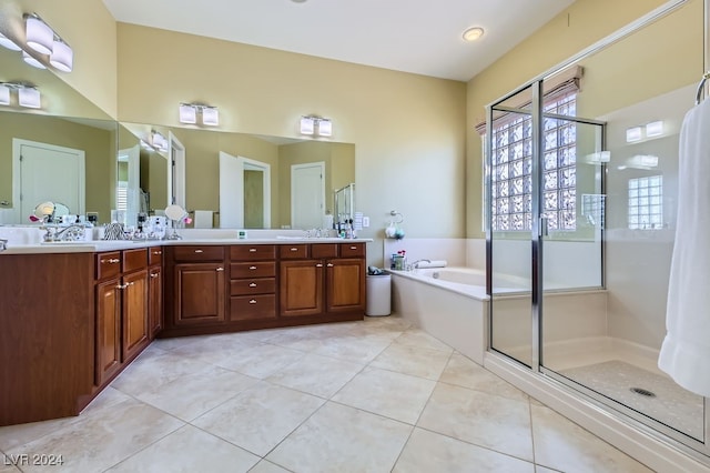 bathroom featuring tile patterned flooring, vanity, and independent shower and bath