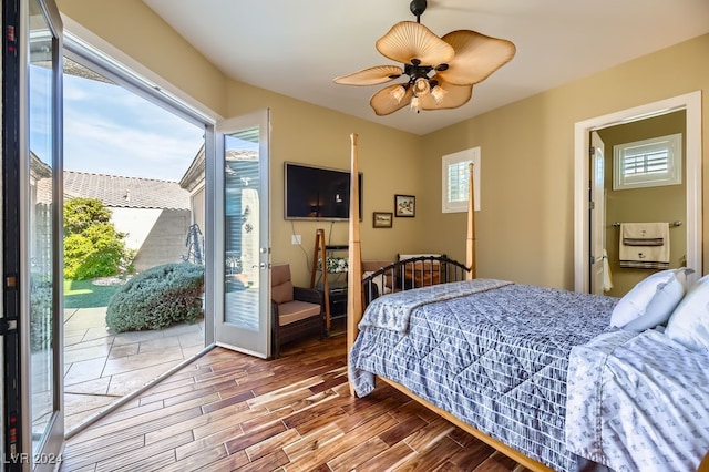 bedroom with access to exterior, hardwood / wood-style floors, and ceiling fan