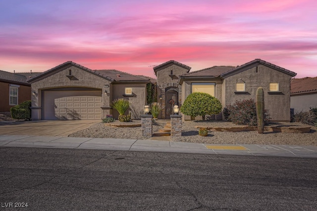 view of front of home with a garage