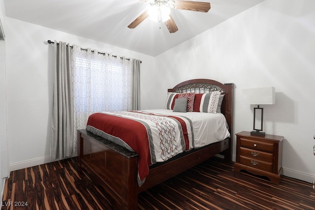 bedroom with ceiling fan and dark hardwood / wood-style floors