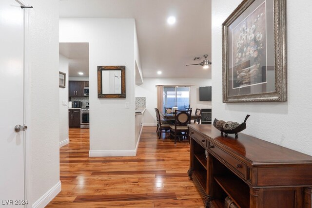 hall with wood-type flooring