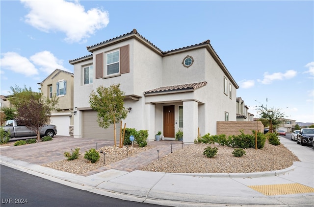 mediterranean / spanish-style house featuring a garage