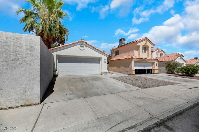 mediterranean / spanish-style home featuring a garage