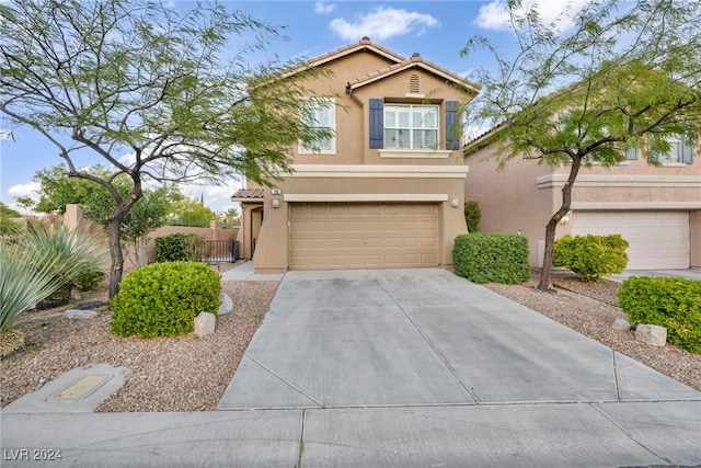 view of front of property with a garage