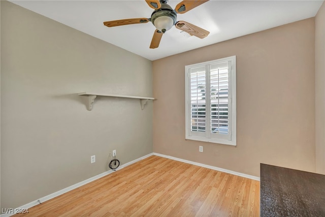 spare room featuring hardwood / wood-style floors and ceiling fan