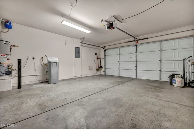 garage featuring gas water heater, a garage door opener, and electric panel