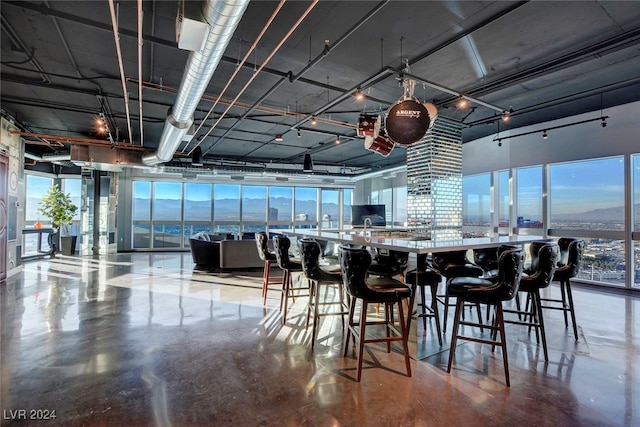 dining area featuring concrete floors