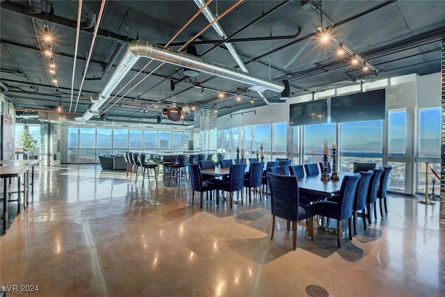 dining area featuring concrete floors