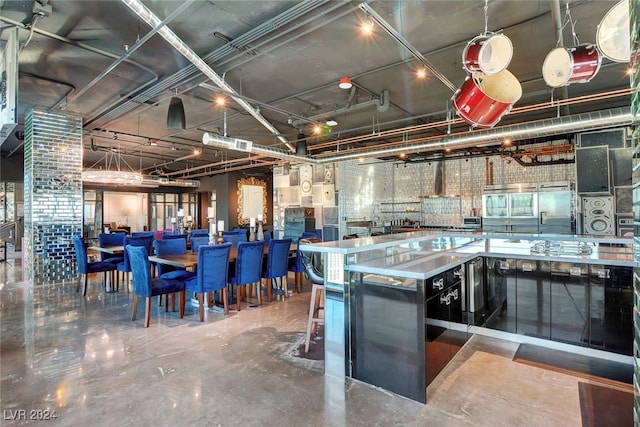 kitchen featuring concrete floors