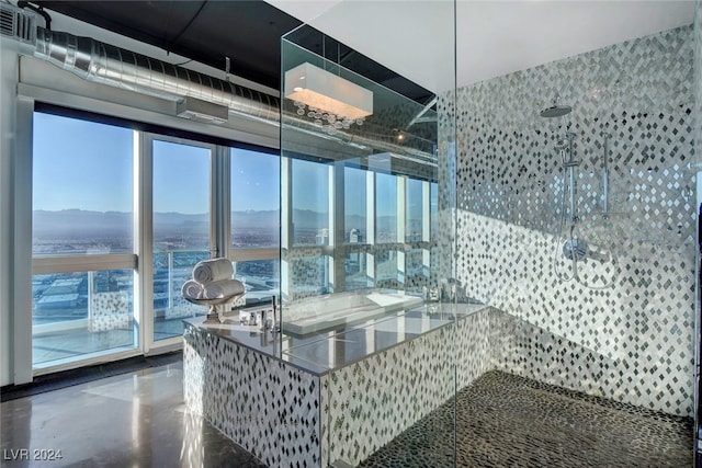 bathroom with concrete flooring and walk in shower