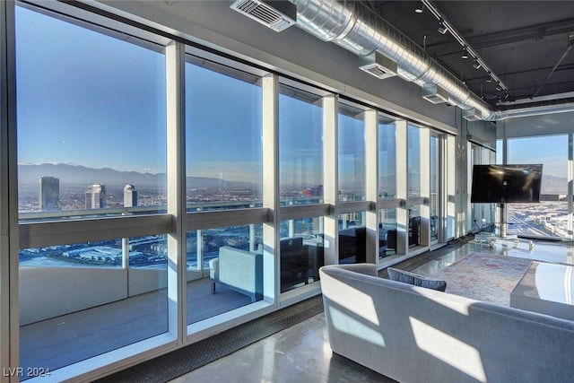 interior space with outdoor lounge area and a mountain view