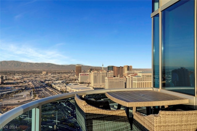 balcony featuring a mountain view