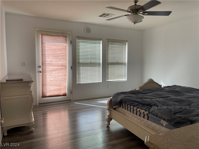 bedroom featuring ceiling fan and dark hardwood / wood-style flooring