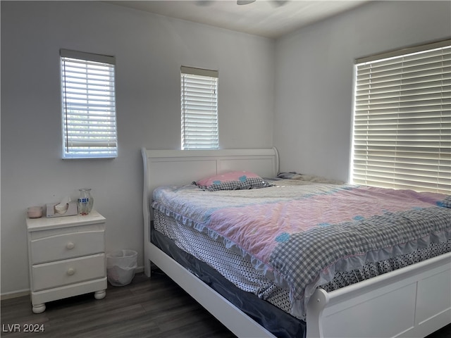 bedroom featuring ceiling fan and dark hardwood / wood-style floors