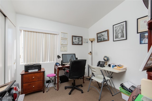 office featuring light carpet and vaulted ceiling