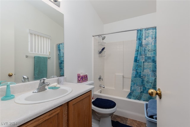 full bathroom with toilet, shower / bath combo, vanity, and vaulted ceiling