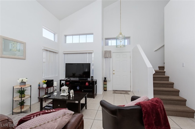 living room featuring high vaulted ceiling and light tile patterned flooring