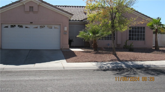 ranch-style house featuring a garage