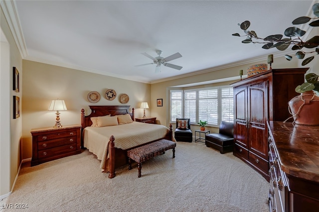 carpeted bedroom with ceiling fan and crown molding