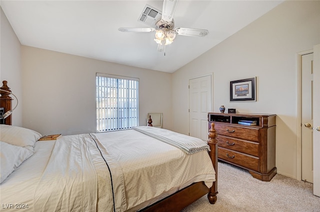 carpeted bedroom with ceiling fan and lofted ceiling