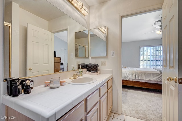 bathroom featuring vanity, tile patterned floors, and ceiling fan