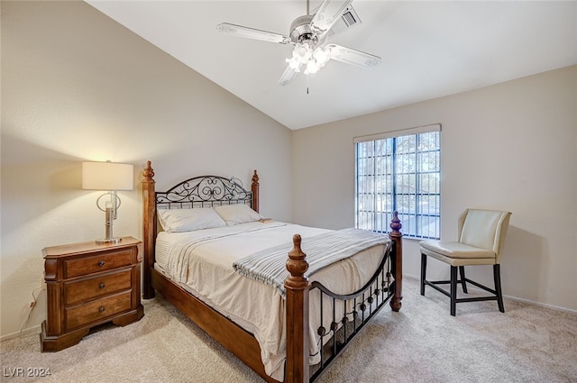 carpeted bedroom with ceiling fan and lofted ceiling