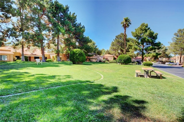 view of home's community featuring a lawn