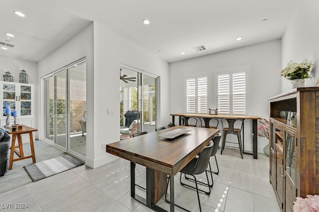 dining area featuring ceiling fan and light tile patterned floors