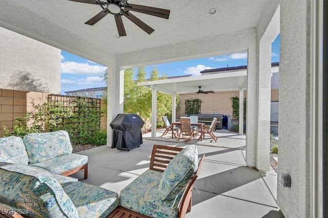 view of patio with outdoor lounge area and grilling area