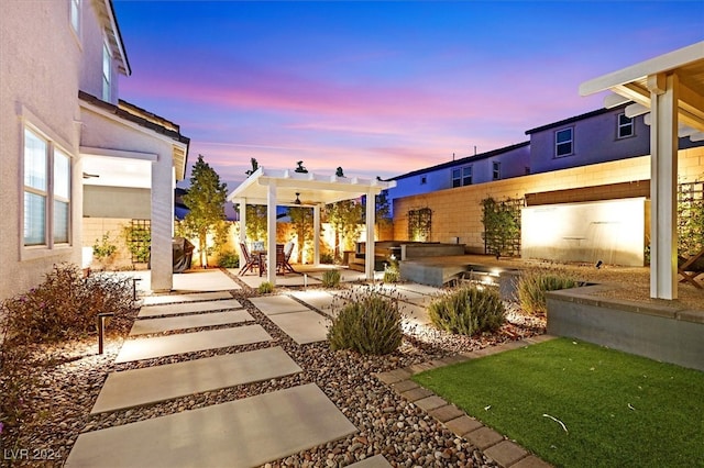 exterior space featuring ceiling fan and a patio area