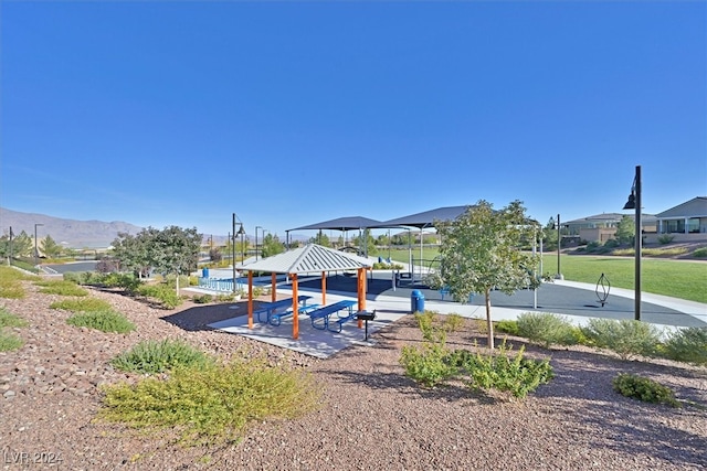 view of play area featuring a gazebo and a mountain view