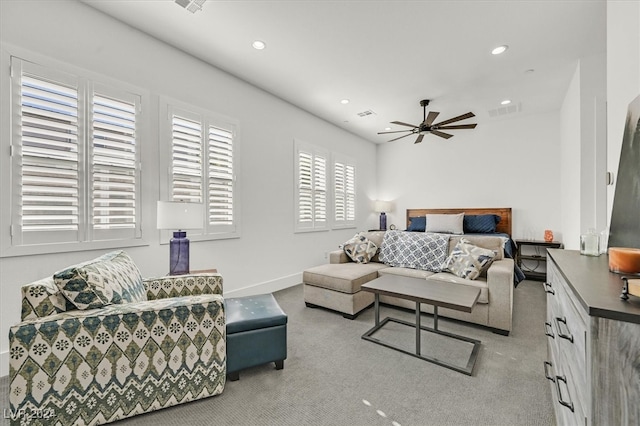 bedroom featuring ceiling fan and light colored carpet