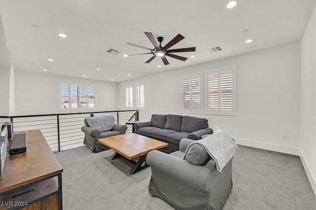 living room with ceiling fan and light carpet