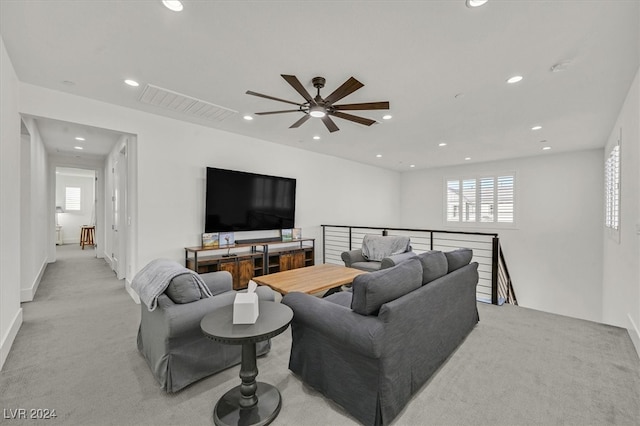 living room featuring ceiling fan and light colored carpet