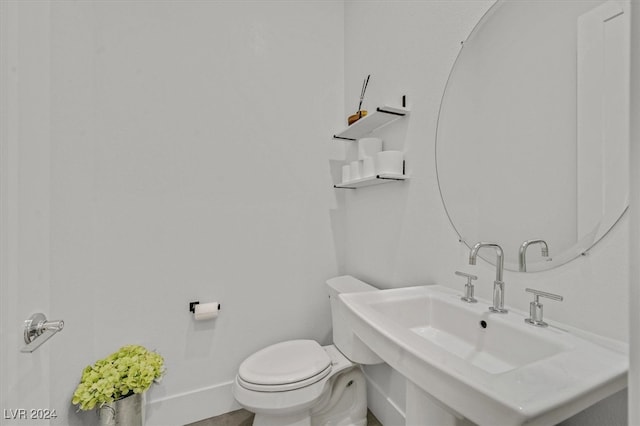 bathroom with toilet and sink