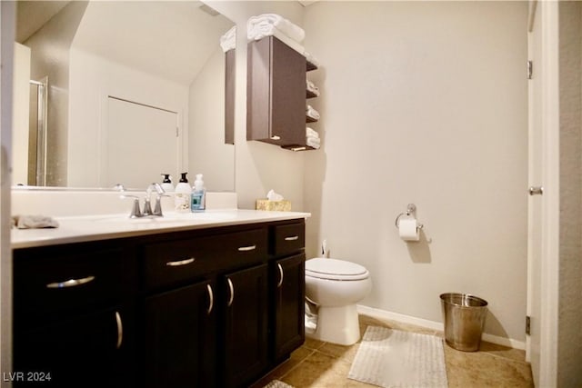 bathroom featuring tile patterned floors, vanity, and toilet