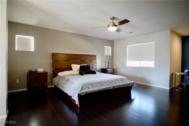 bedroom featuring dark hardwood / wood-style floors and ceiling fan