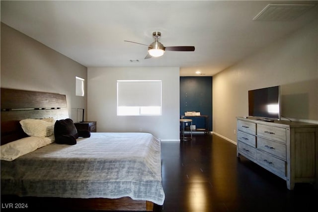 bedroom featuring ceiling fan and dark hardwood / wood-style flooring