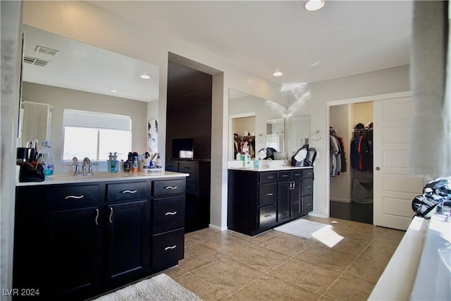 bathroom with tile patterned flooring and vanity