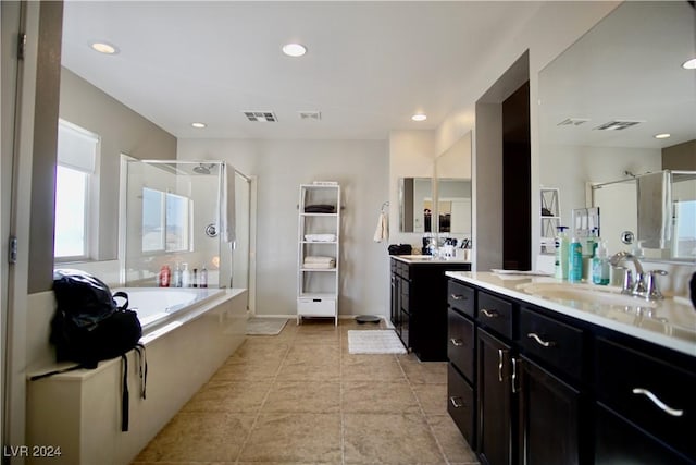 bathroom featuring tile patterned floors, vanity, and independent shower and bath