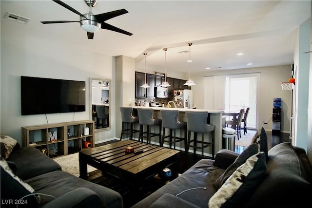 living room with ceiling fan