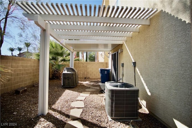 view of patio with central AC unit and a pergola