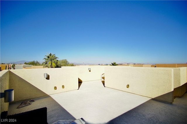 view of patio featuring a balcony