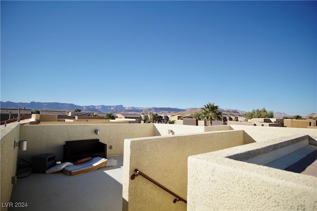 view of patio / terrace with a mountain view