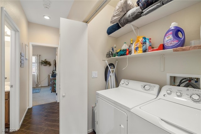 clothes washing area featuring independent washer and dryer and dark colored carpet